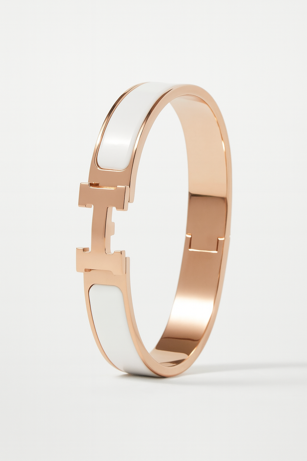 Rose gold and white bracelet on a light gray background