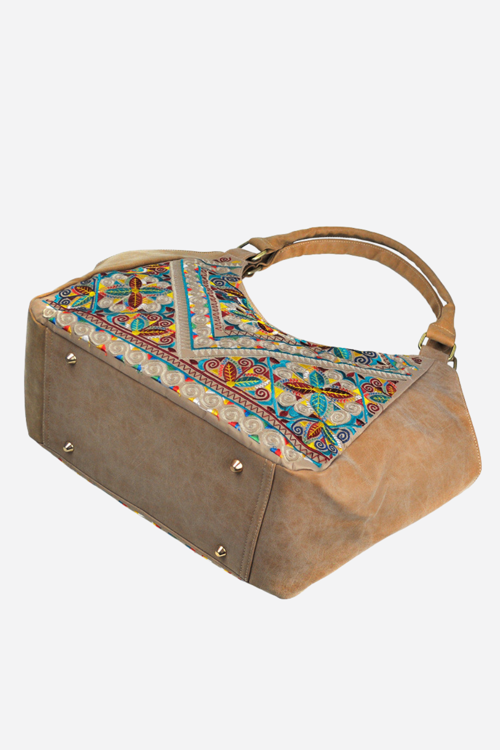 Brown handbag with colorful patterned flap on a white background